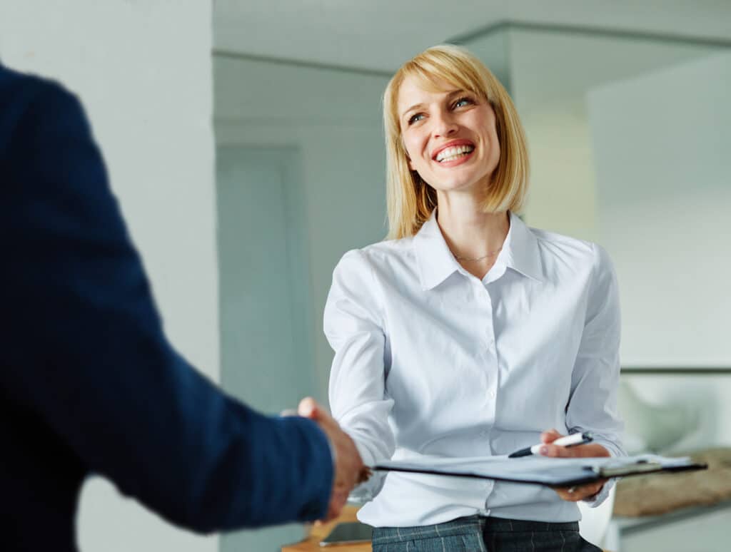young business businesswoman handshake hand shake shaking meeting agreement office teamwork partner businessman hand